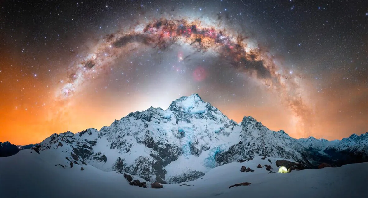 The Milky Way arching over snow-covered Aoraki / Mt. Cook, New Zealand